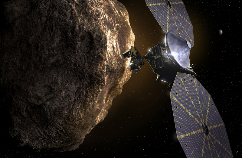 Графическое изображение зонда Lucy, пролетающего рядом с астероидом. Графика Southwest Research Institute
